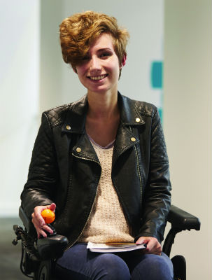 Woman in motorized wheelchair with stylish look