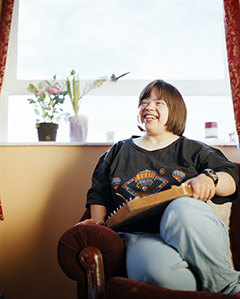 Women smiling while playing with a game.